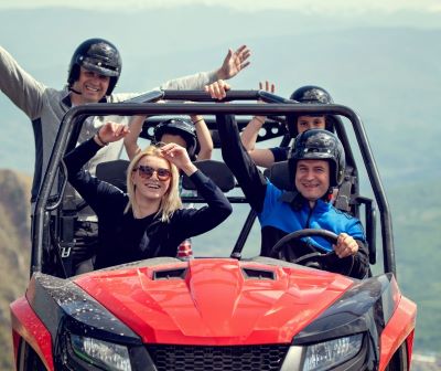a group of people riding in a buggy