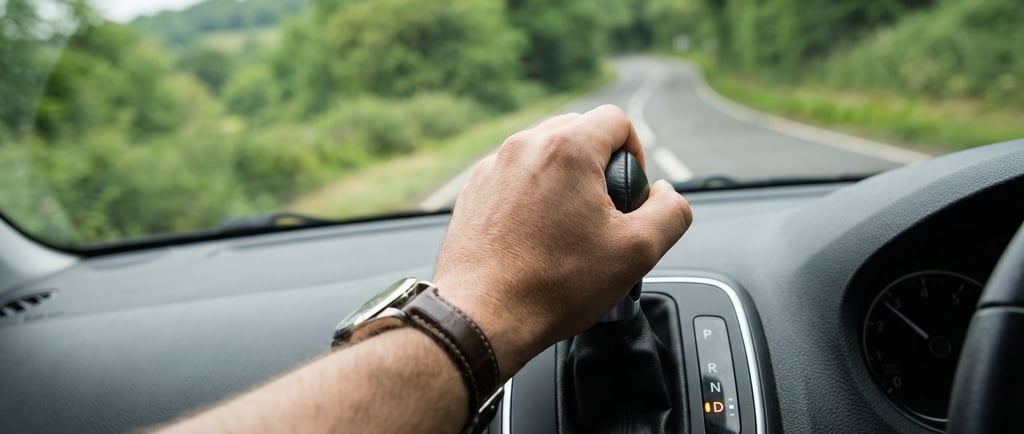 Learner driver shifting into drive during automatic driving lessons in Loughton
