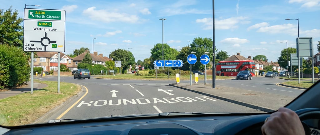 View from a learner driver car approaching a large roundabout near Chingford