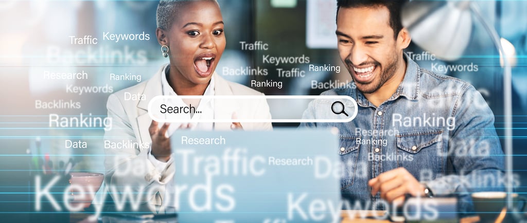 a man and woman looking at a laptop computer screen