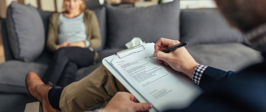 a man and woman sitting on a couch in a living room