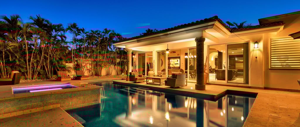 a luxury house with a pool and a lounge area