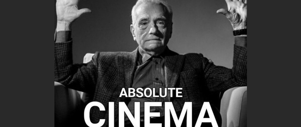 An older man in a suit and tie, sitting in an armchair with his hands up and highlighting the frese