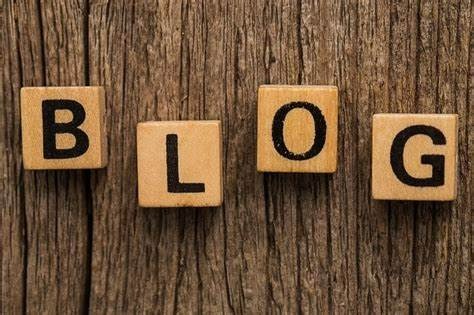 Polished wooden blocks with letters written on it forming the word blog