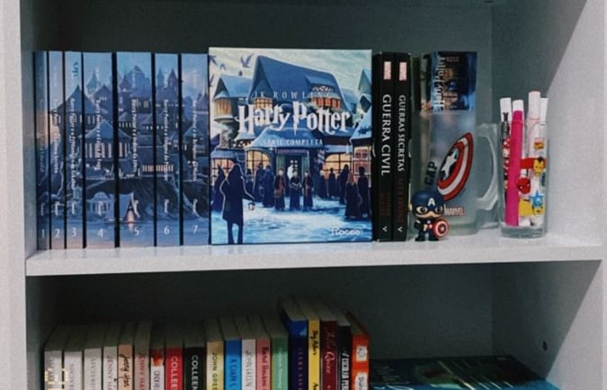 a bookshelf with books and decorations