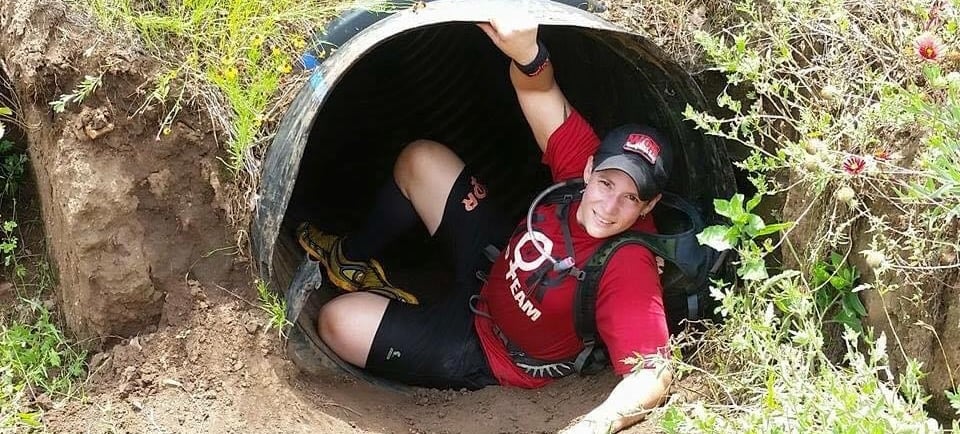 Texas Spartan female racer upcoming out of tunnel