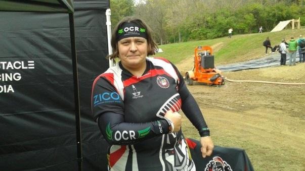a woman in a black and white outfit holding a bag