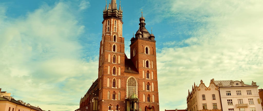 a large church with a tall tower in the middle of it