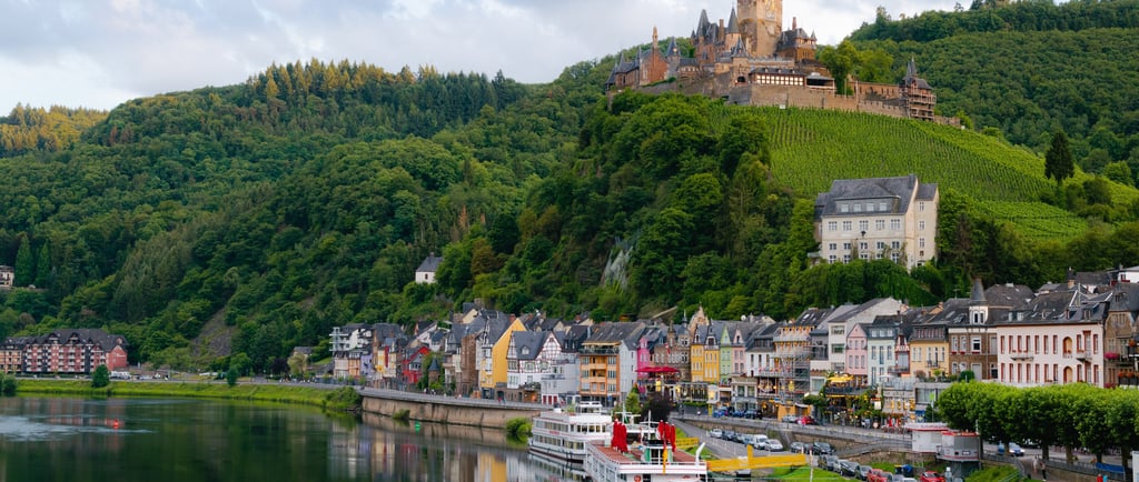 a river with a castle in the background