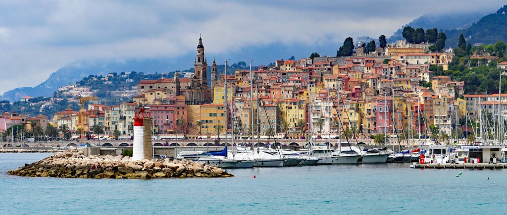 a harbor with boats and buildings in the background