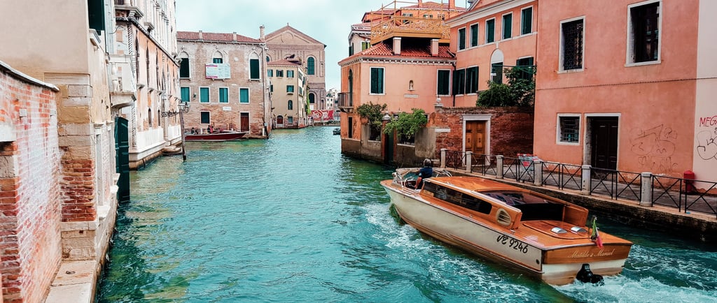 a boat on a river in a city