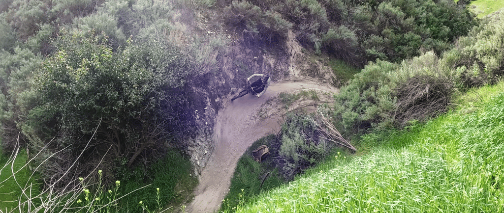 Mountain biker going around corner at hulda crooks park in loma linda