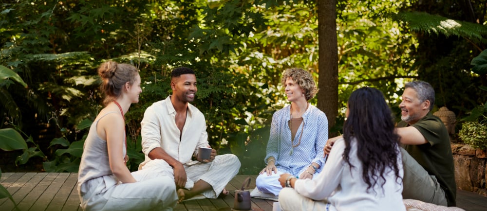 a group of people sitting on a deck
