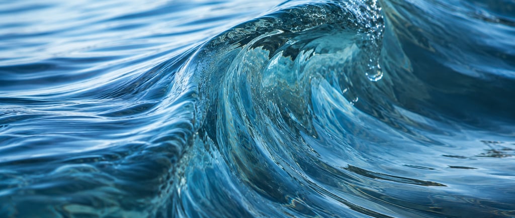Close-up of a blue ocean wave curling with textured water ripples and sunlight reflections.