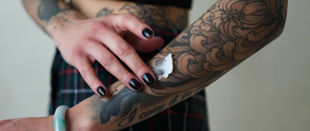 Proper tattoo aftercare with protective wrap at Lewisville's Aura Tattoo Studios.