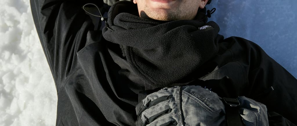 a man laying on his back in the snow
