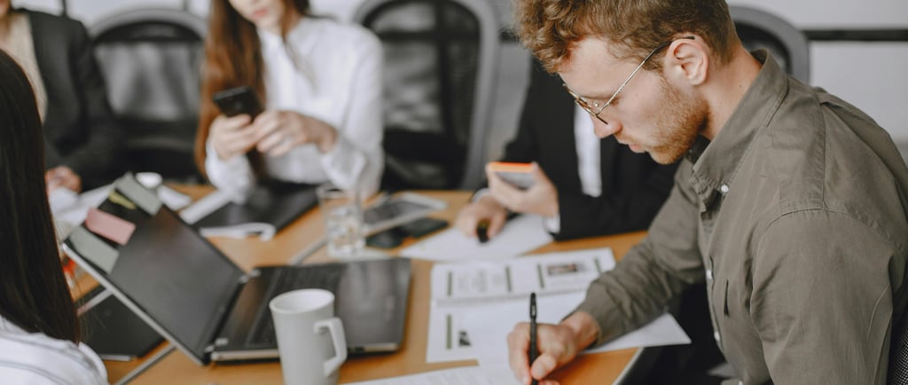 A team reviewing their post-merger cyber integration plan