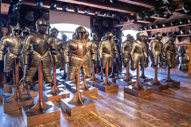 Rows of full knight armor suits at the Landeszeughaus museum.
