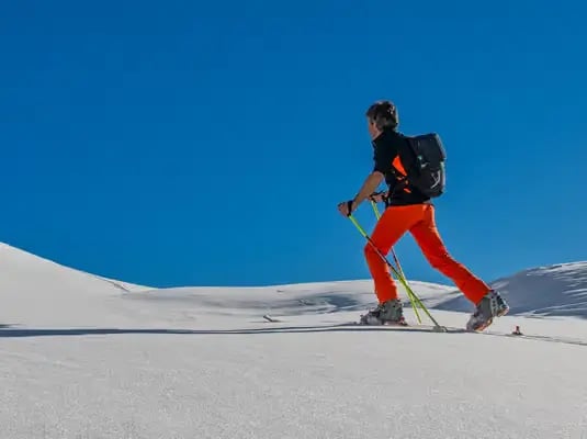 Beginner skier on a sunny slope at Stubai Glacier, Innsbruck.