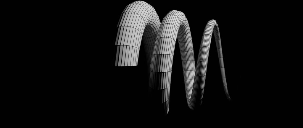 a group of three large white and black curved metal pipes