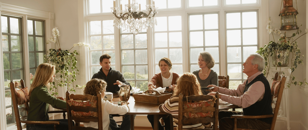 family sitting together at the dinner table