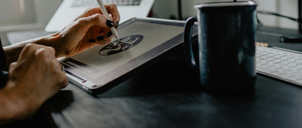 A Person drawing on a tablet creating a professional design in advertising