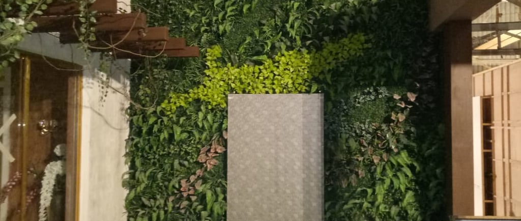 a room with a green wall and a fountain