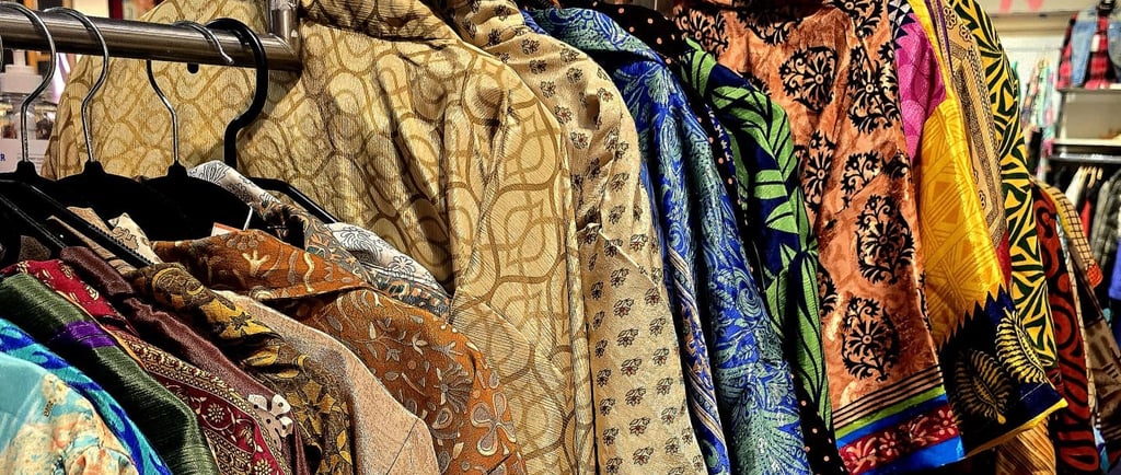 a variety of clothes and accessories on display in a store