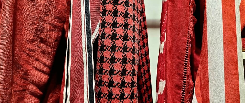 a bunch of different red coloured pieces of clothing