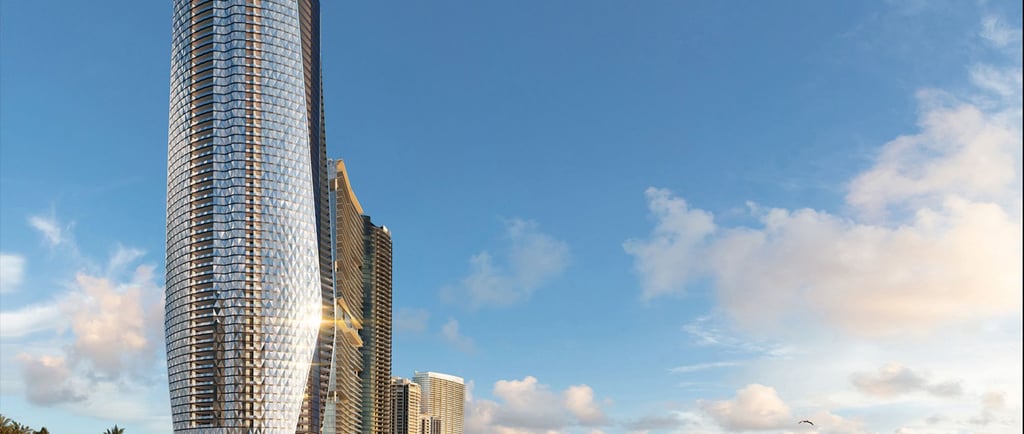 a beach with a large building in the background