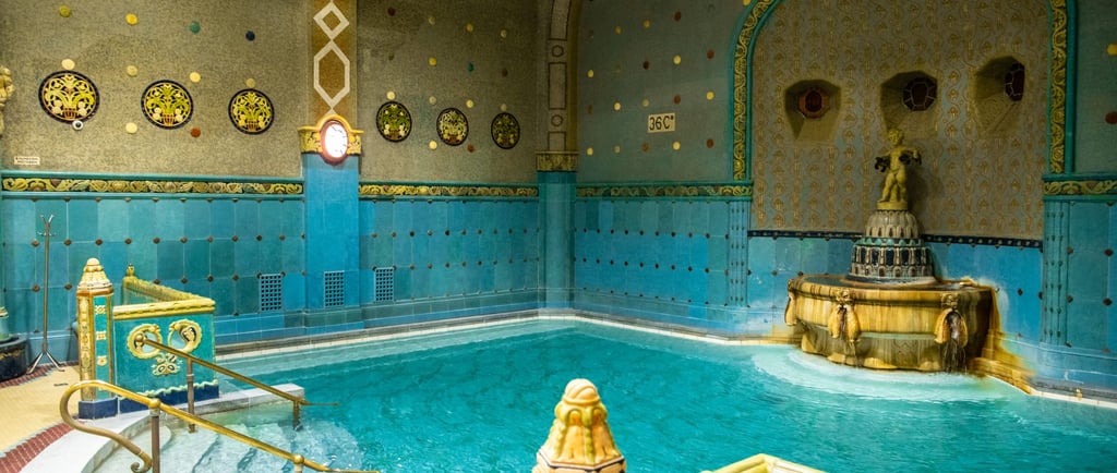 a pool with a fountain in the middle of it