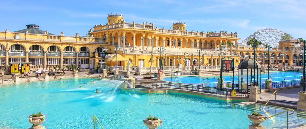 a large pool with a fountain and a fountain
