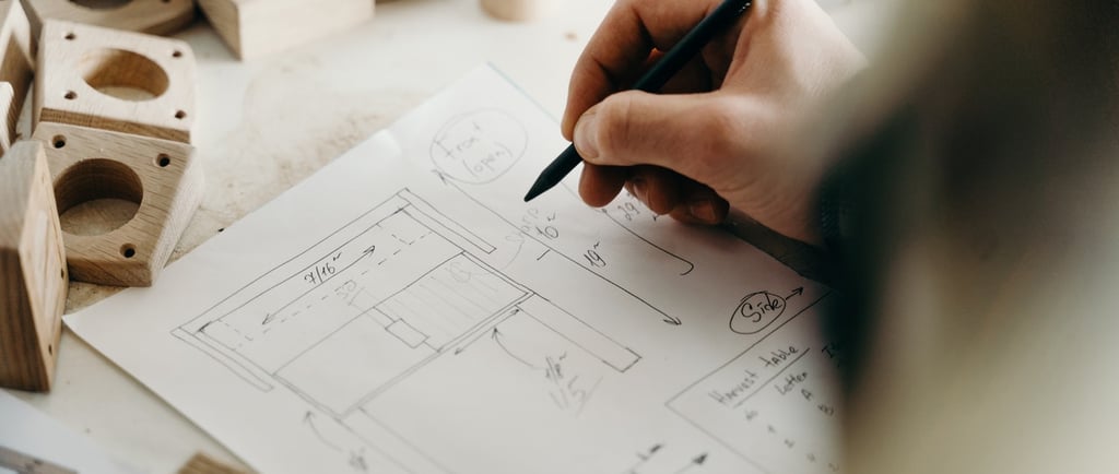 a person is holding a pencil and drawing a picture