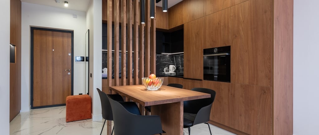 a dining room with a table and chairs
