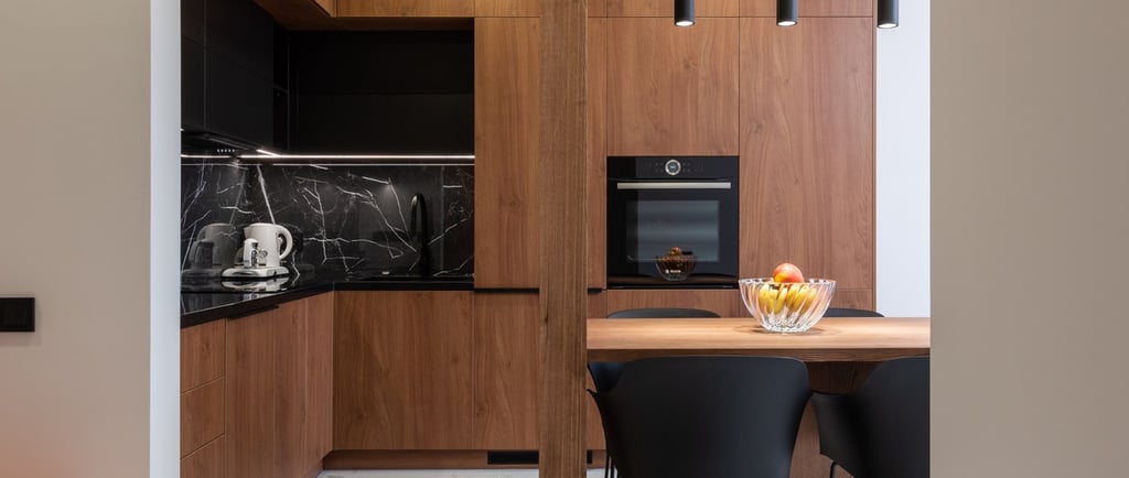 a kitchen with a table and chairs and a bowl of fruit