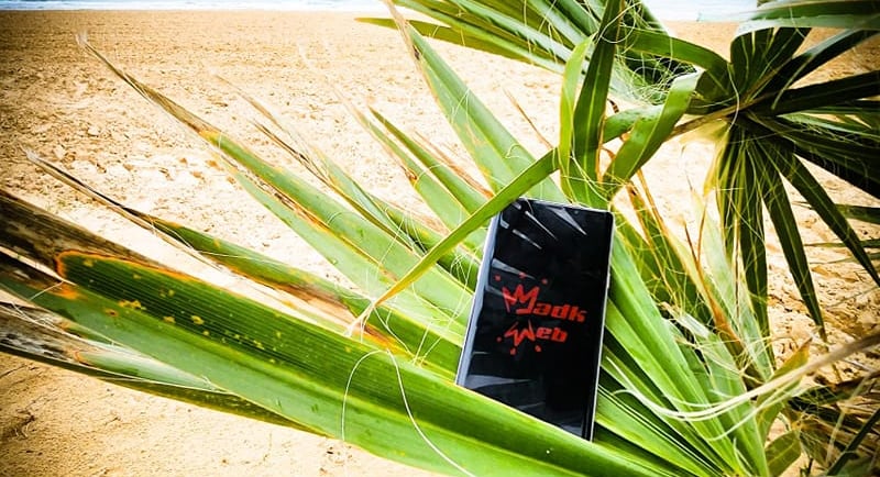 a phone phone case sitting on a beach