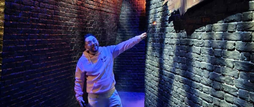 a man pointing at a sign that says,'it's a sign for