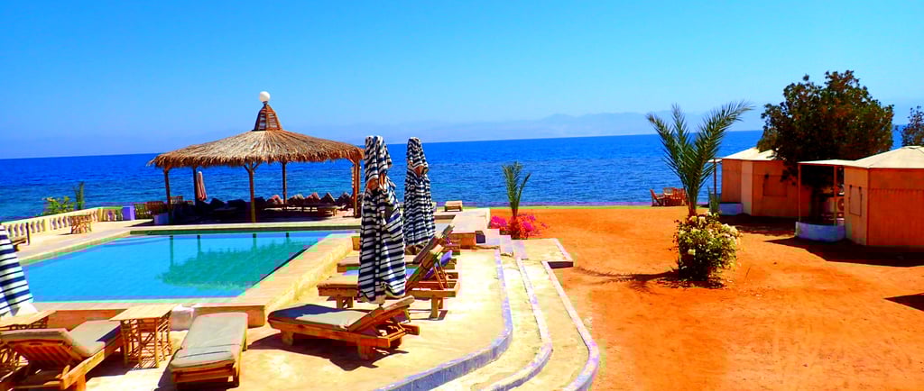 Beach with pool in front of the Red sea at Bedouin star Egypt