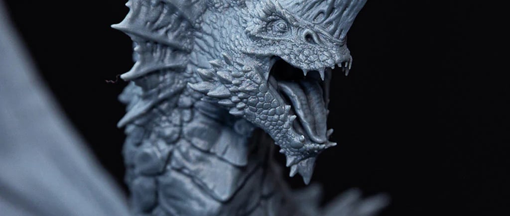 a close up of a dragon like creature printed with a 3d resin printer