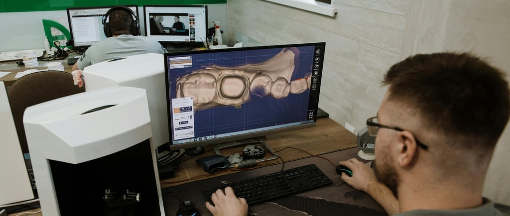 a man sitting at a desk with a computer monitor and a computer monitor 3d designing