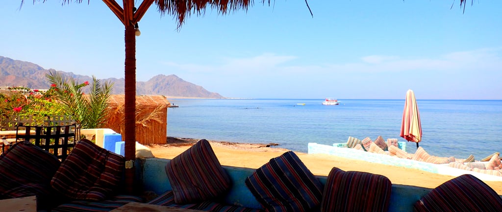 Palm tree roof top shadow for a relaxing lounge area on the beach Egypt