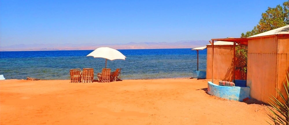 Beach with chairs and umbrella viewing the red sea in Egypt
