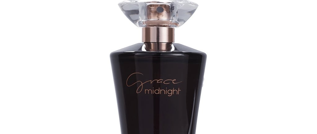 a bottle of perfume with a glass bottle of perfume