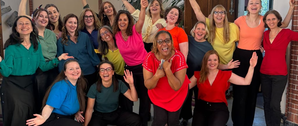 People in many colors on a stage