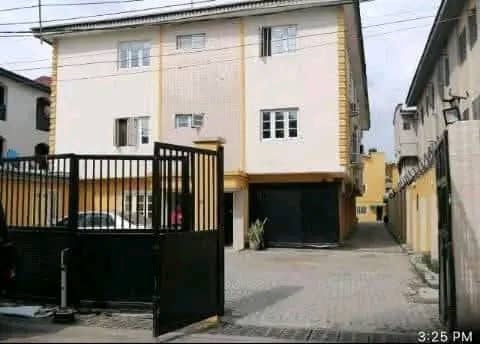 a house with a gated entrance to a house