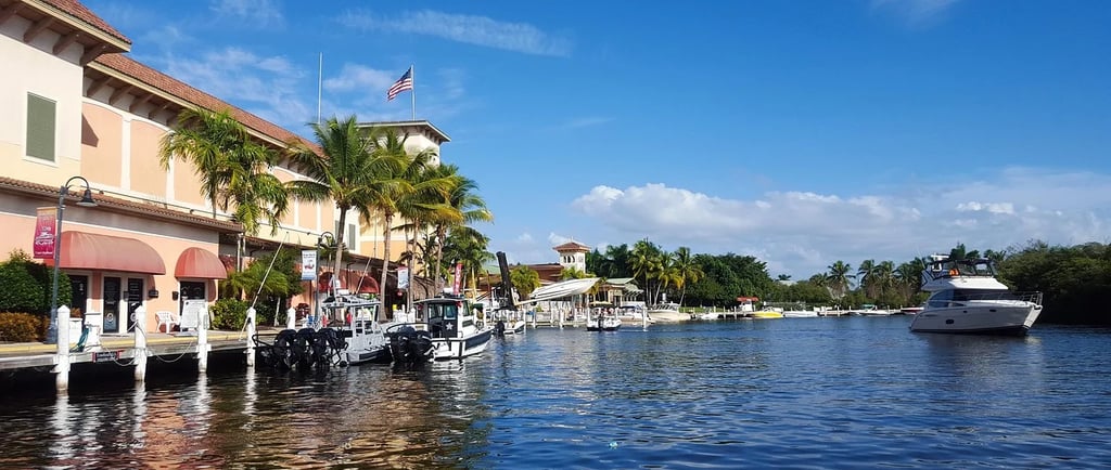a boat docked at a dock with a boat in the water