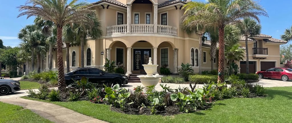 a large house with a large lawn and palm trees