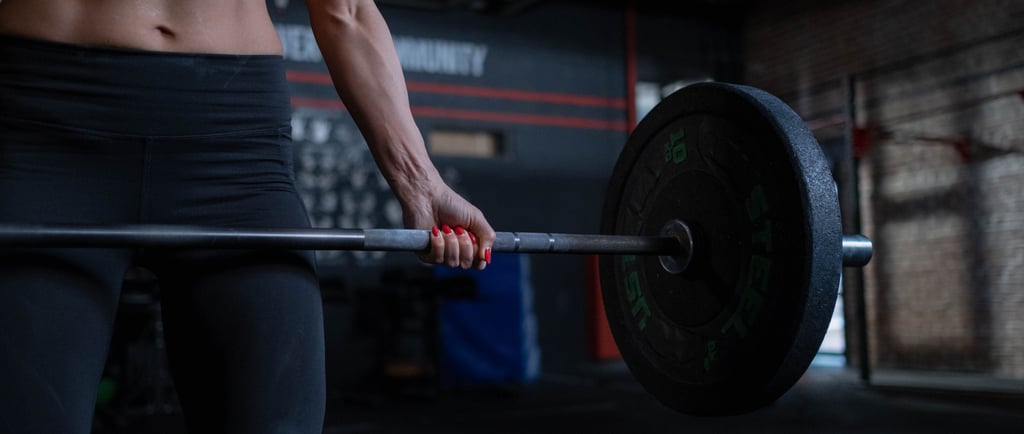 Woman over 35 strength training with dumbbells in gym — Fit & Free Life
