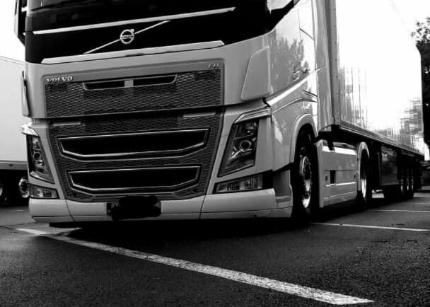 a truck with a large truck behind it