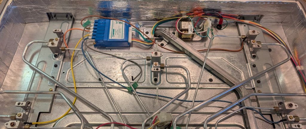 ge monogram cooktop the inside view - spark module and transformer